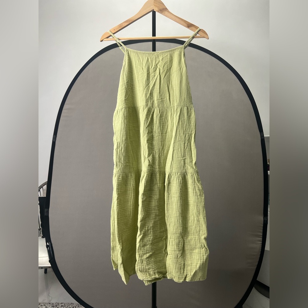 Lime Green Sleeveless midi dress with pockets.